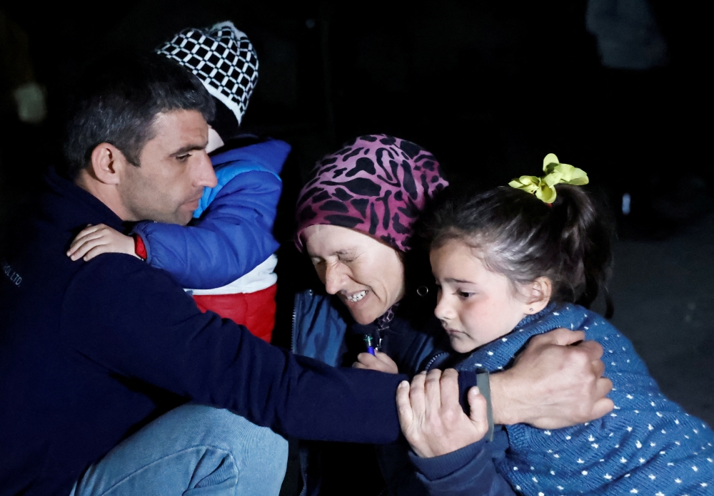 People react after a quake in Antakya in Hatay province, Turkey