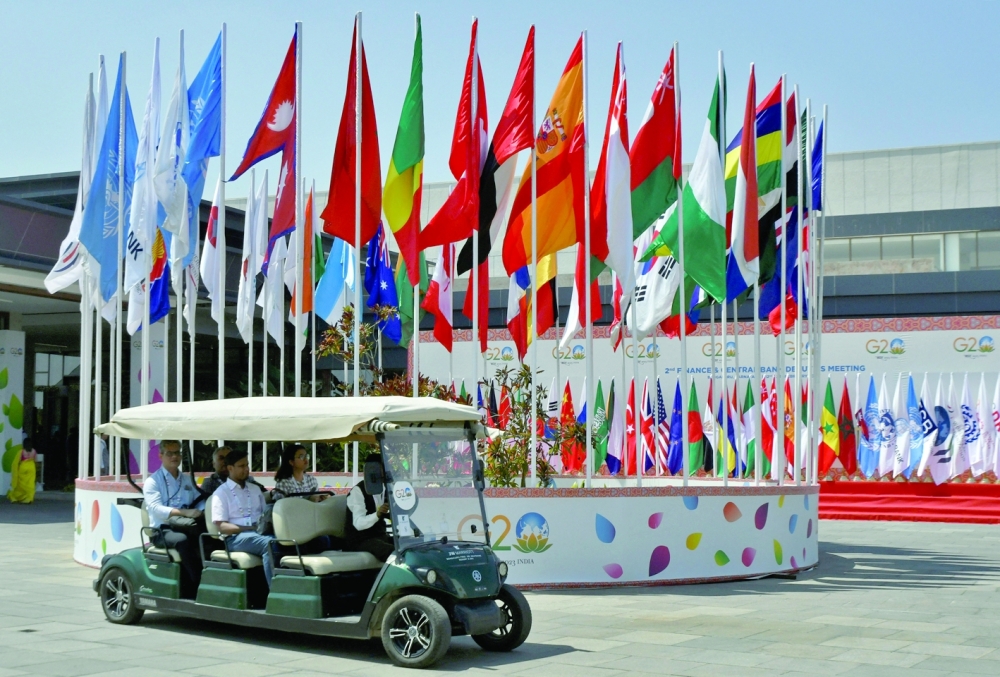 Delegates ride in a buggy at G20 finance officials meeting venue near Bengaluru