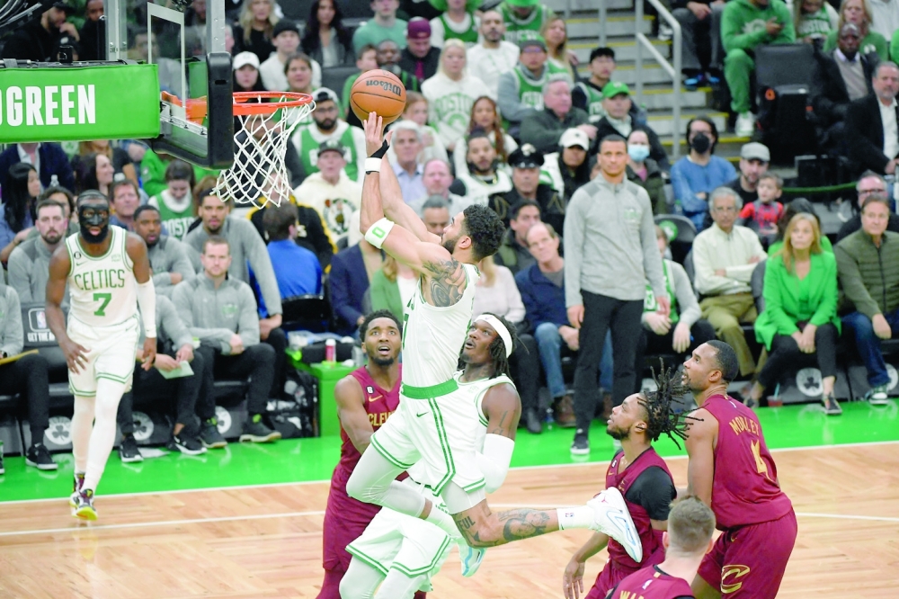 Mar 1, 2023; Boston, Massachusetts, USA;  Boston Celtics forward Jayson Tatum (0) drives to the basket during the first half against the Cleveland Cavaliers at TD Garden. Mandatory Credit: Bob DeChiara-USA TODAY Sports
