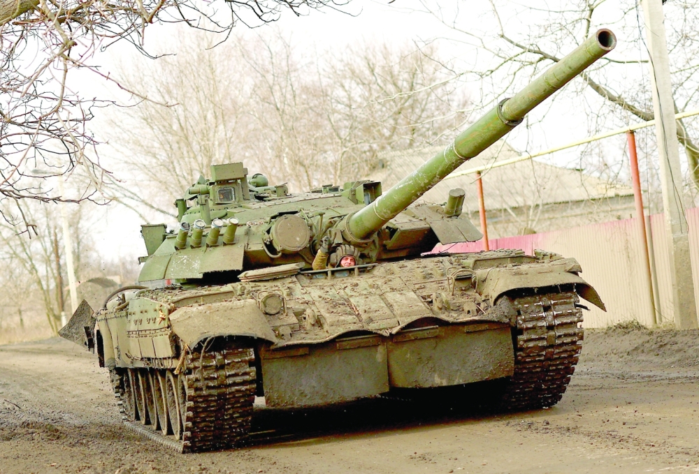 An Ukrainian serviceman rides a tank on a road towards the frontline town of Bakhmut amid Russia’s attack on Ukraine, in Chasiv Yar, Donetsk region. - Reuters