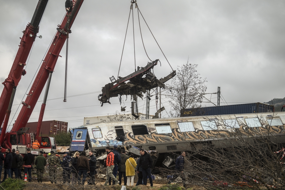 A crane is used to clear wreckage at the site of a train crash near the city of Larissa, Greece on Wednesday, March 1, 2023. (Angelos Tzortzinis/The New York Times)