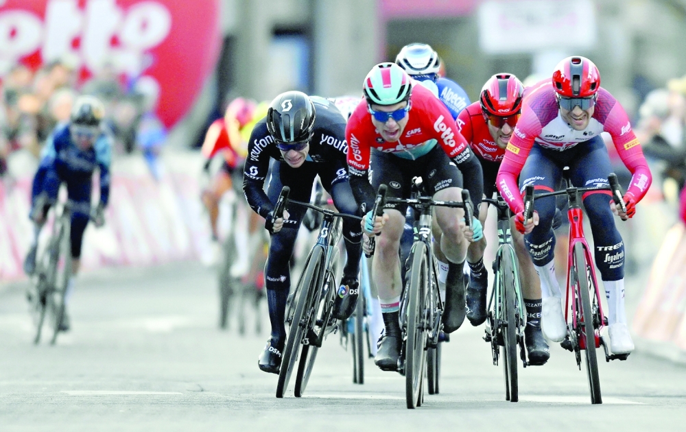 French Hugo Hofstetter of Arkea-Samsic, Belgian Milan Menten of Lotto-Dstny and Belgian Edward Theuns of Trek-Segafredo sprint to the finish of the Grand Prix du Samyn, one day cycling race, 209 km, from Quaregnon to Dour, first (out of 10) race of the Lotto Cycling Cup, in Dour on February 28, 2023. Belgium OUT
 (Photo by ERIC LALMAND / BELGA / AFP)

