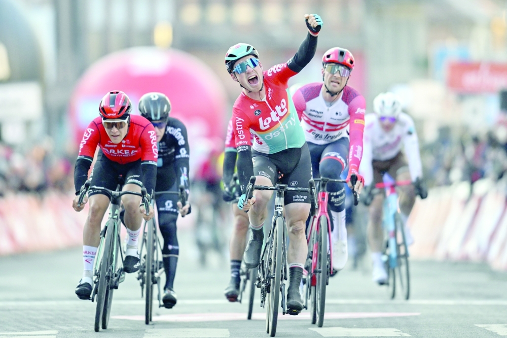 Belgium's Milan Menten of Lotto-Dstny celebrates as he crosses the finish line to win the Grand Prix du Samyn, a 209km one-day cycling race between Quaregnon and Dour in Belgium, in Dour, on February 28, 2023.  - Belgium OUT
 (Photo by ERIC LALMAND / BELGA / AFP)

