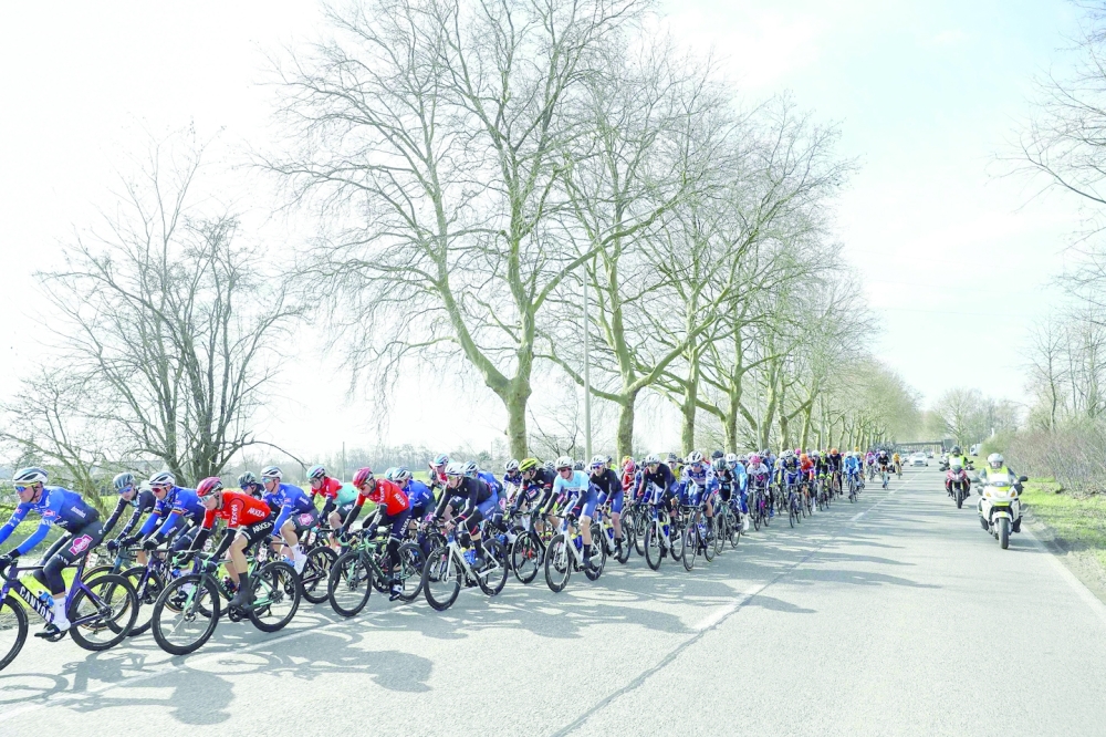 The pack rides during the Grand Prix du Samyn, 209km one-day cycling race between Quaregnon and Dour in Belgium, as part of the Lotto Cycling Cup, in Quaregnon, on February 28, 2023.  - Belgium OUT
 (Photo by DAVID PINTENS / BELGA / AFP)

