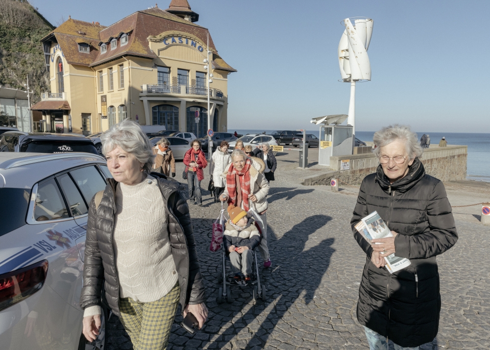 Martine Mirville and her friends visit the coast, overlooking the English Channel, in Granville, France, on Feb. 15, 2023. (Andrea Mantovani/The New York Times)