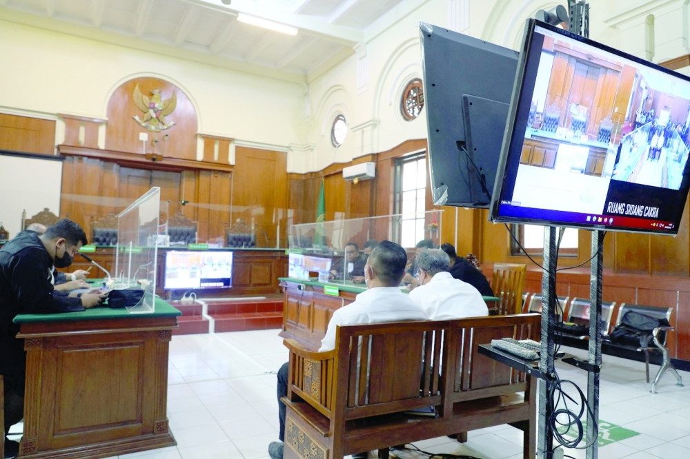 Chairman of the Arema FC organising committee Abdul Haris and Security Officer Suko Sutrisno attend the verdict announcement at the court in Surabaya. — Reuters 