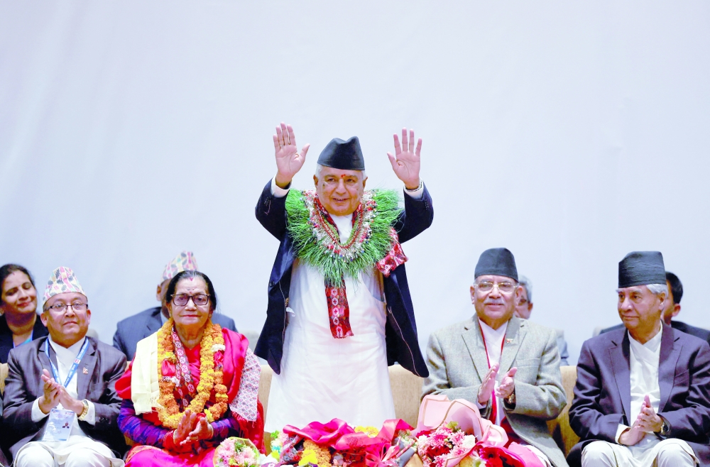 Newly-elected President Ram Chandra Paudel waves towards the media after being elected as the third president of Nepal at the Parliament in Kathmandu, Nepal. — Reuters