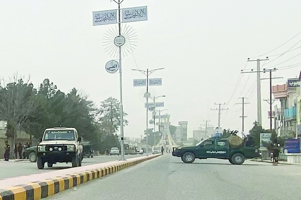Taliban security personnel block a road in Mazar-i-Sharif following a blast at the office of Taliban governor of Afghanistan's Balkh province. — AFP 