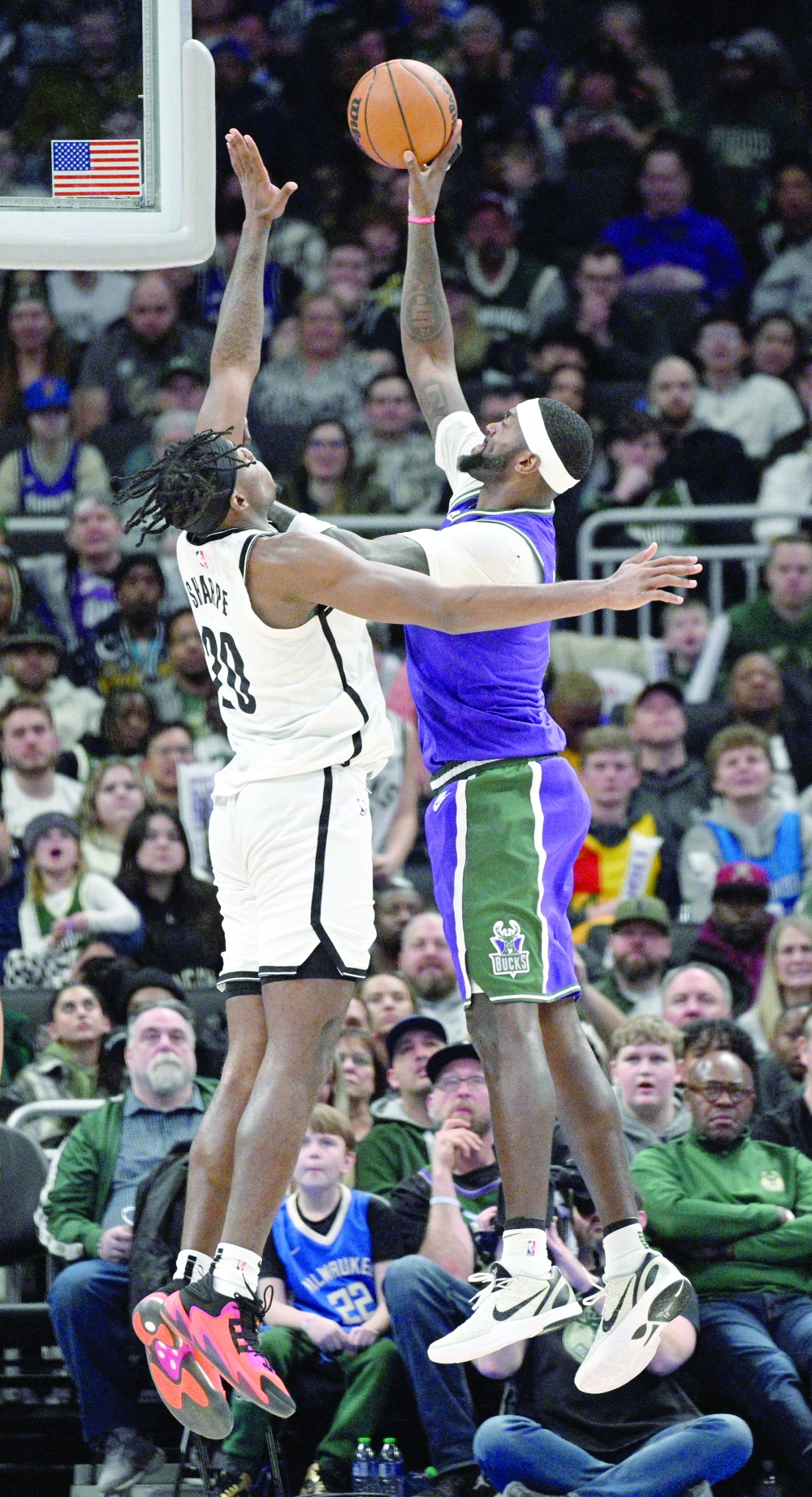 Mar 9, 2023; Milwaukee, Wisconsin, USA; Milwaukee Bucks forward Bobby Portis (9) puts up a shot against Brooklyn Nets center Day'Ron Sharpe (20) in the second half at Fiserv Forum. Mandatory Credit: Michael McLoone-USA TODAY Sports
