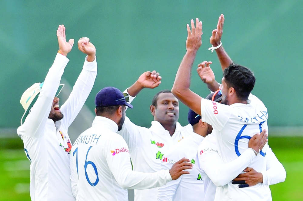 Sri Lanka players celebrate the wicket of New Zealand's Tom Blundell during the second day of the first Test cricket match between New Zealand and Sri Lanka at Hagley Oval in Christchurch on March 10, 2023. (Photo by Sanka Vidanagama / AFP)

