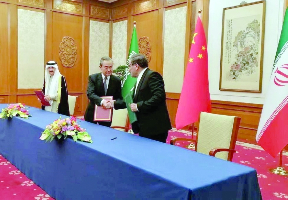 Saudi Arabia’s National Security Council adviser Mosaed Bin Mohammad Al Aiban, China’s foreign minister Wang Yi and Iran’s National Security Council head Ali Shamkhani after signing the agreement in Beijing on Friday.  

