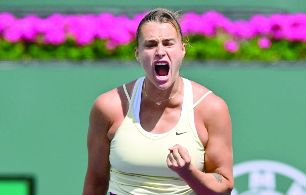 Aryna Sabalenka of Belarus celebrates winning a point against Coco Gauff of the US in their quarterfinal tennis match at the 2023 WTA Indian Wells Open on March 15, 2023 in Indian Wells, California. (Photo by Frederic J. BROWN / AFP)

