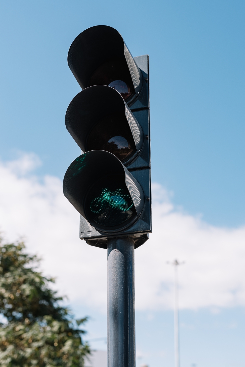 A green light for cyclists at Main Green Corridor, a 1.4-mile stretch of greenery that connects multiple parks, in Lisbon, Portugal, Feb. 28, 2023. (Rodrigo Cardoso/The New York Times)