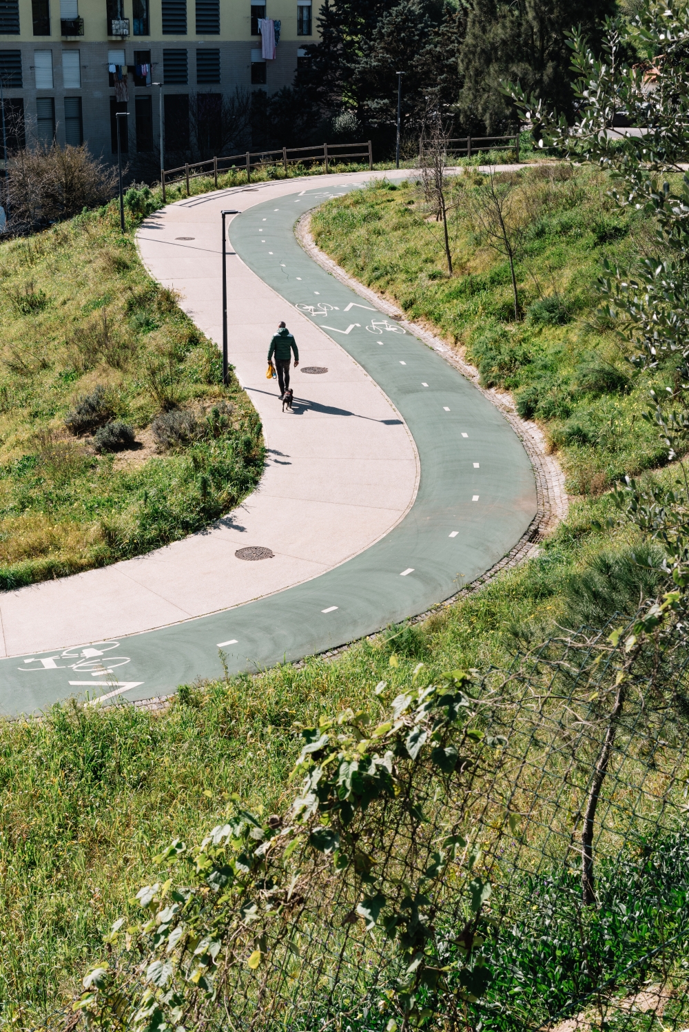 A bike path at Main Green Corridor, a 1.4-mile stretch of greenery that connects multiple parks, in Lisbon, Portugal, Feb. 28, 2023. (Rodrigo Cardoso/The New York Times)