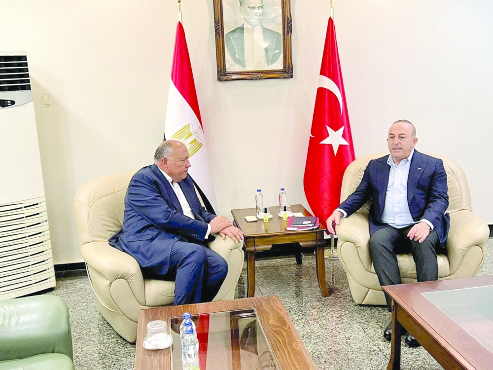 Turkiye's Foreign Minister Mevlut Cavusoglu with his Egyptian counterpart Sameh Shoukry in Mersin, Turkiye. - Reuters