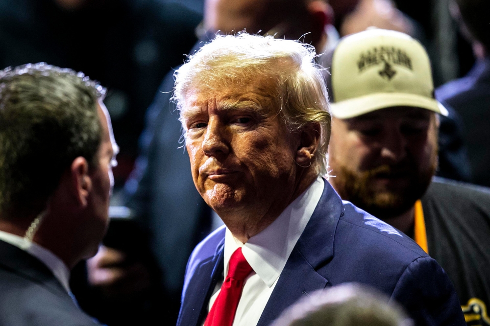 Mar 18, 2023; Tulsa, OK, USA;  Former President Donald Trump greets fans as he arrives before the finals during the sixth session of the NCAA Division I Wrestling Championships, Saturday, March 18, 2023, at BOK Center in Tulsa, Okla. Mandatory Credit: Joseph Cress-USA TODAY Sports