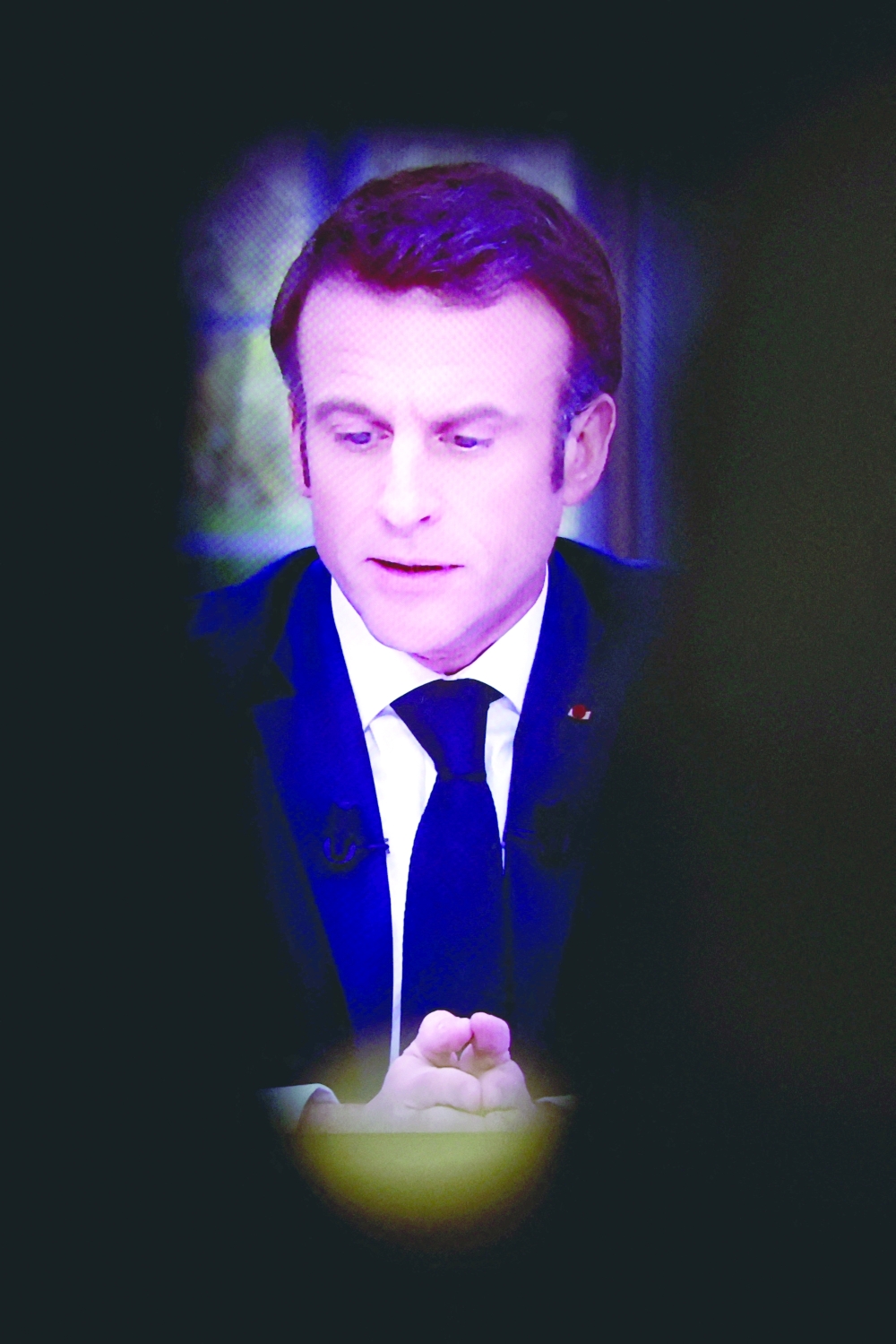 French President Emmanuel Macron speaks during an interview on national television in Paris on Wednesday. -- Reuters