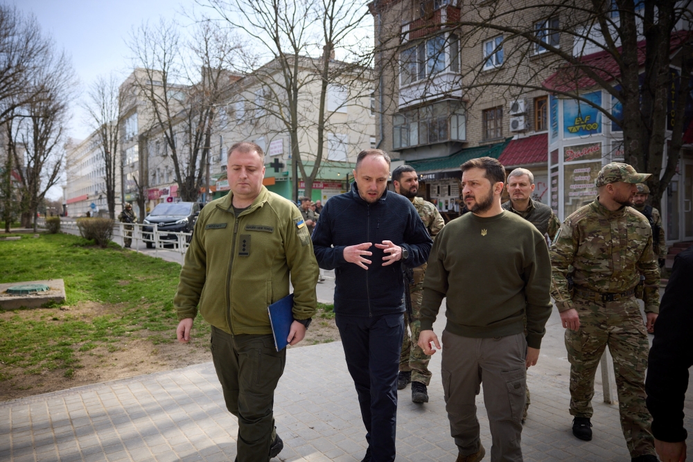 Ukraine's President Volodymyr Zelenskiy walks along a street, amid Russia's attack on Ukraine, as he visits Kherson, Ukraine. — Reuters 