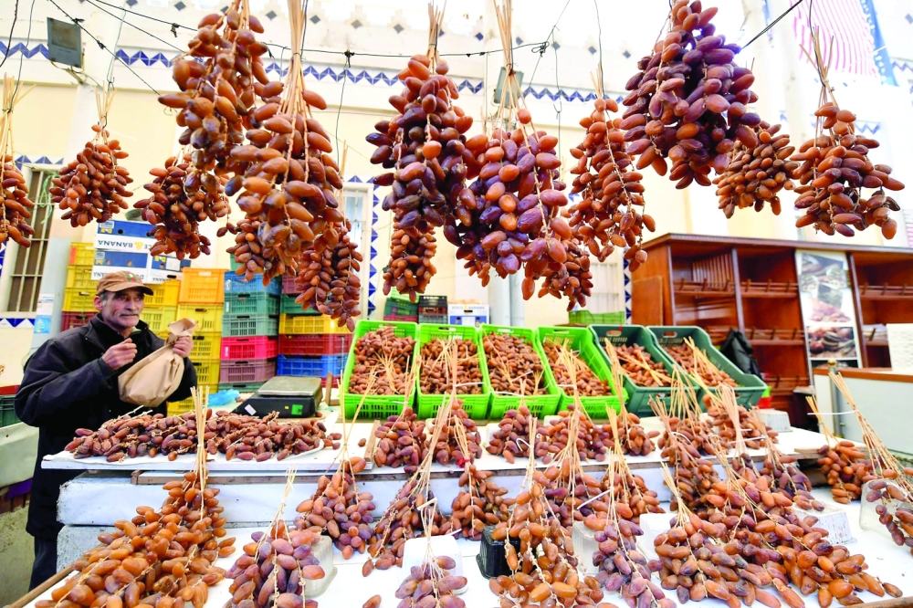 TUNISIA: A Tunisian vendor displays dates for sale at a market in Tunis on the first day of Ramadhan. - AFP