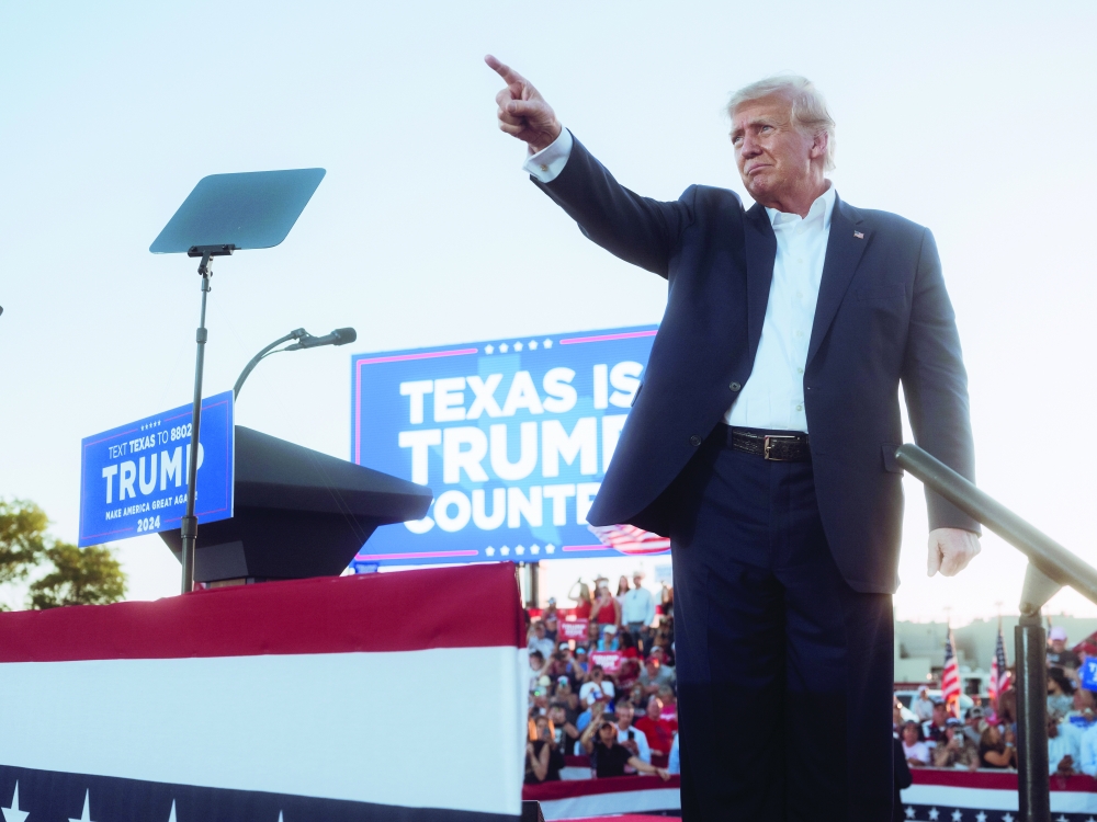 Former president Donald Trump greets attendees during a campaign rally at Waco Regional Airport, in Waco, Texas.
