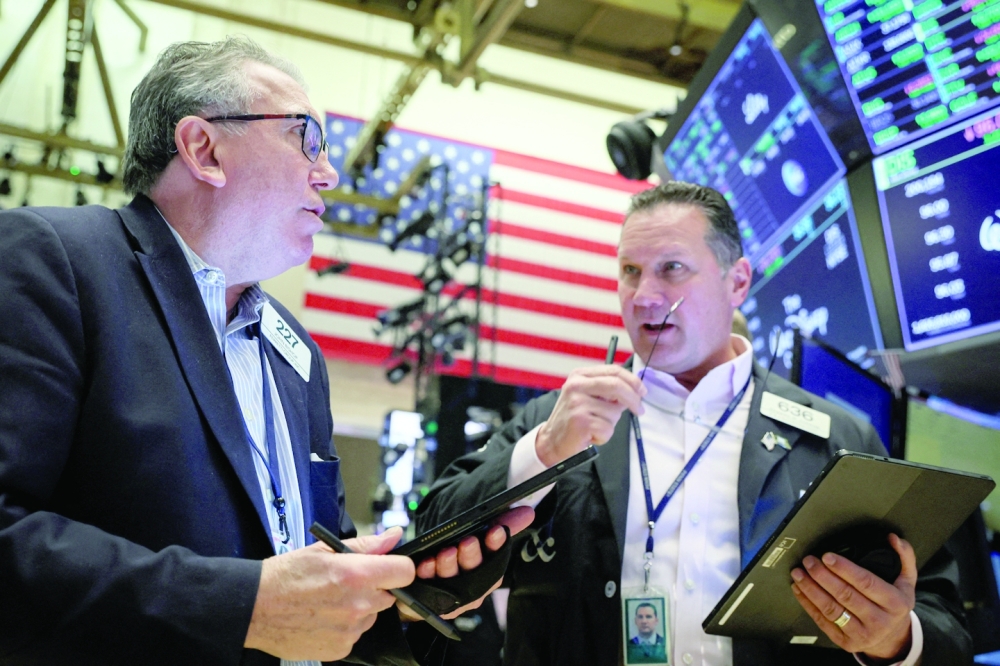 Traders work on the floor of the NYSE in New York