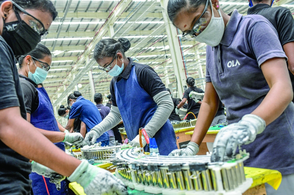 Female workers at an electric scooter factory in the Indian state of Tamil Nadu, on August 24, 2023. (Atul Loke/The New York Times)