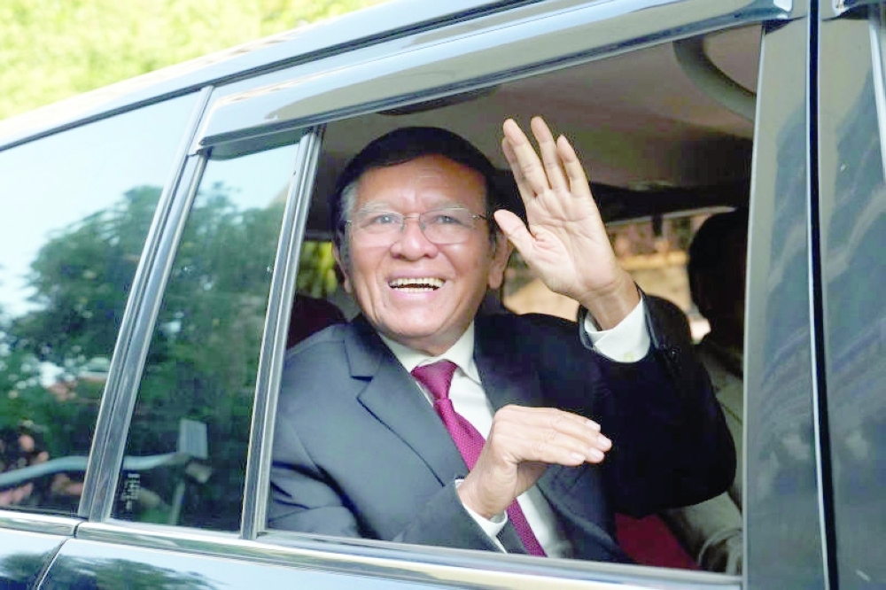 Former Cambodia National Rescue Party (CNRP) leader Kem Sokha leaves his house for the Phnom Penh Municipal Court. File Photo of Reuters 