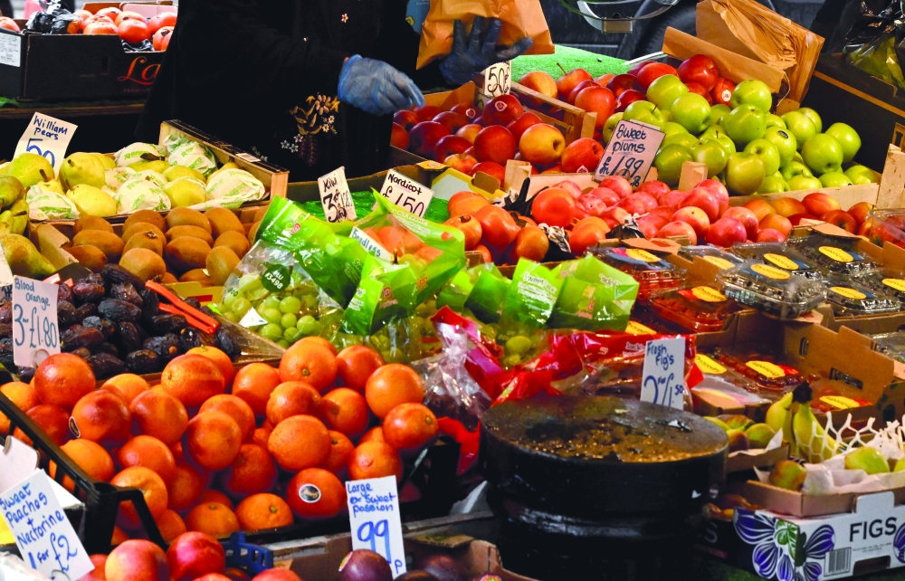 Fresh produce are displayed at a fruit and vegetable stall at Portobello Road in London. - Reuters
