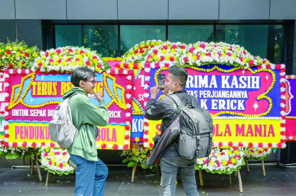 This picture shows wreaths expressing the concern of football fans outside the office of the Indonesian football association in Jakarta on March 30, 2023. FIFA announced on March 29 it had removed Indonesia as hosts of this year's under-20 World Cup amid political turmoil over Israel's participation. (Photo by BAY ISMOYO / AFP)

