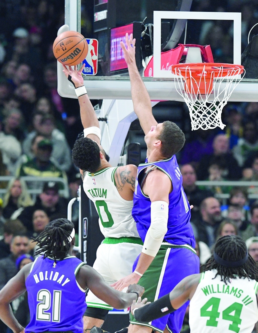 Milwaukee Bucks center Brook Lopez (11) attempts to block the shot of Boston Celtics forward Jayson Tatum (0) in the first half at Fiserv Forum. -- USA TODAY Sports
