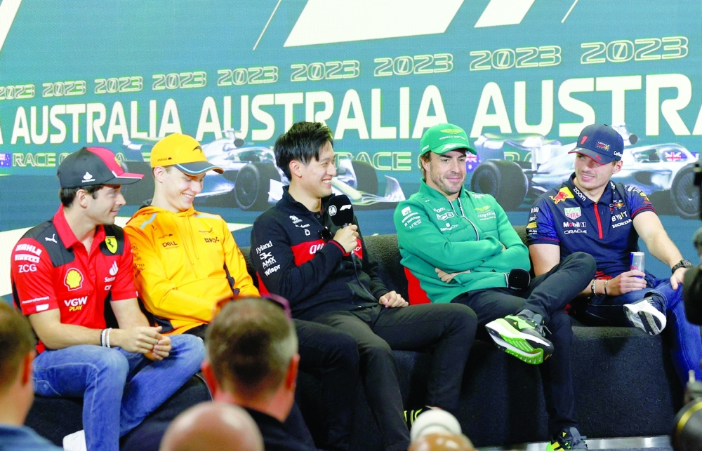 Formula One F1 - Australian Grand Prix - Melbourne Grand Prix Circuit, Melbourne, Australia - March 30, 2023 Ferrari's Charles Leclerc,  McLaren's Oscar Piastri , Alfa Romeo's Guanyu Zhou, Aston Martin's Fernando Alonso and Red Bull's Max Verstappenvduring press conference ahead of the Australian Grand Prix REUTERS/Darrian Traynor
