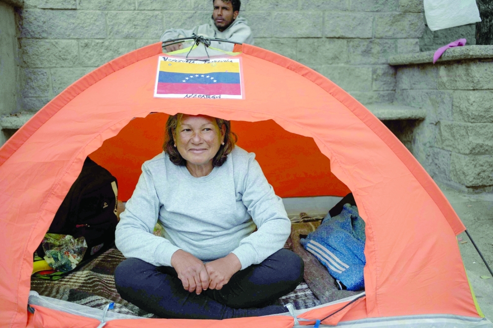 Venezuelan migrant Luisa Jimenez poses in her tent outside the immigration detention centre where 39 migrants died in a fire in Ciudad Juarez, Chihuahua state, Mexico. - AFP


