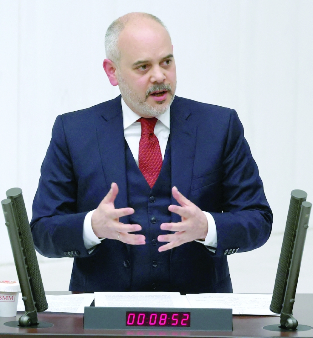 Chairman of Turkish parliament's Foreign Affairs Commission Akif Cagatay Kilic addresses Turkish lawmakers before voting in favour of Finland's bid to join Nato, in the Turkish parliament (picture right) in Ankara. - AFP