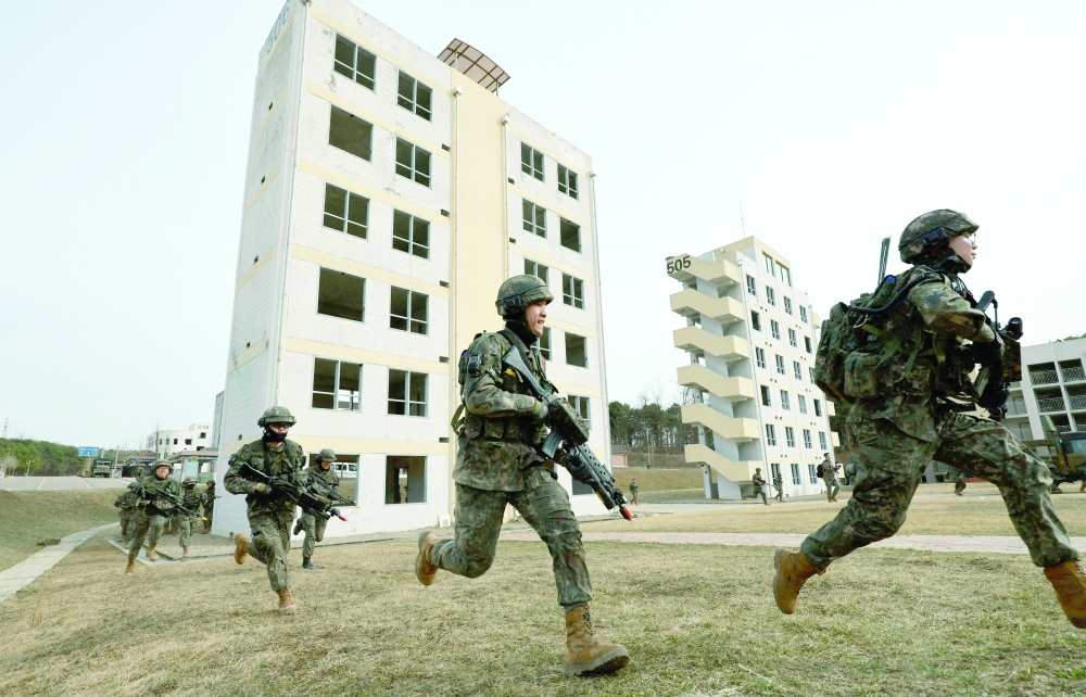 Soldiers take part in a joint military drill which is a part of the Freedom Shield joint military exercise between South Korea and US, at a military training field. — Reuters