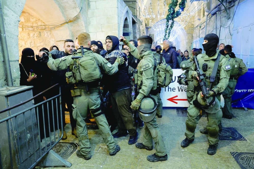 Israeli border policemen take position near Al-Aqsa Mosque while tension arise during clashes with Palestinians. — Reuters 