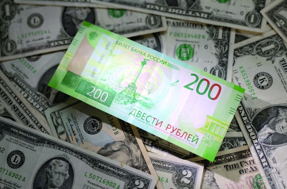 Russian rouble and US dollar banknotes are seen in this illustration. - Reuters

