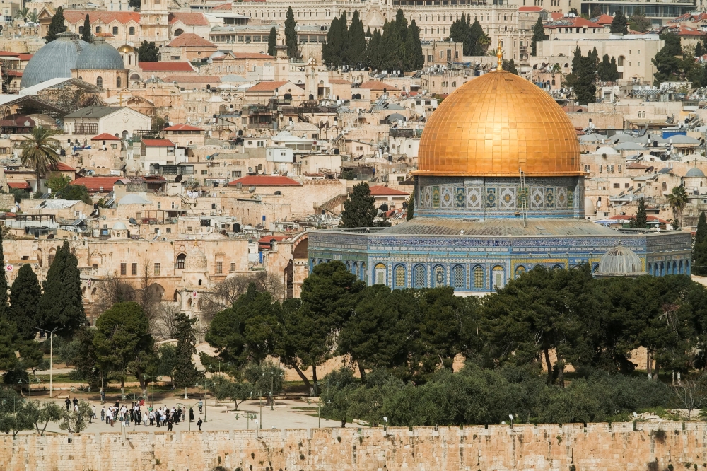 A view taken from the Mount of Olives shows a group of Jewish visitors on the Al Aqsa compound, in Jerusalem's Old City