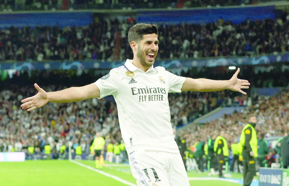 Soccer Football - Champions League - Quarter Finals - First Leg - Real Madrid v Chelsea - Santiago Bernabeu, Madrid, Spain - April 12, 2023 Real Madrid's Marco Asensio celebrates scoring their second goal REUTERS/Albert Gea
