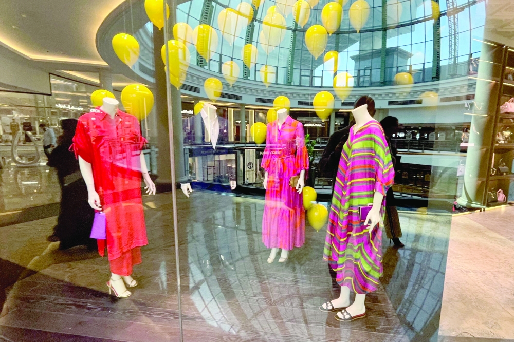 Colourful dresses, part of the Ramadhan collection, are displayed in the window of the Carolina Herrera shop in the Mall of the Emirates in Dubai. - AFP