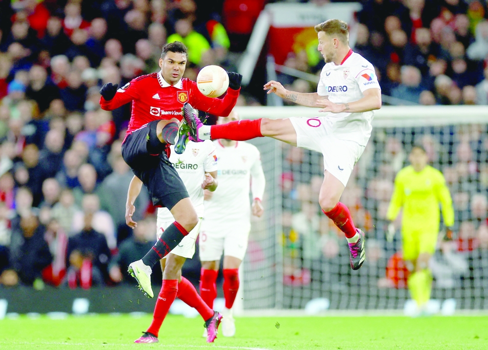 Manchester United's Casemiro in action with Sevilla's Ivan Rakitic Action Images via Reuters