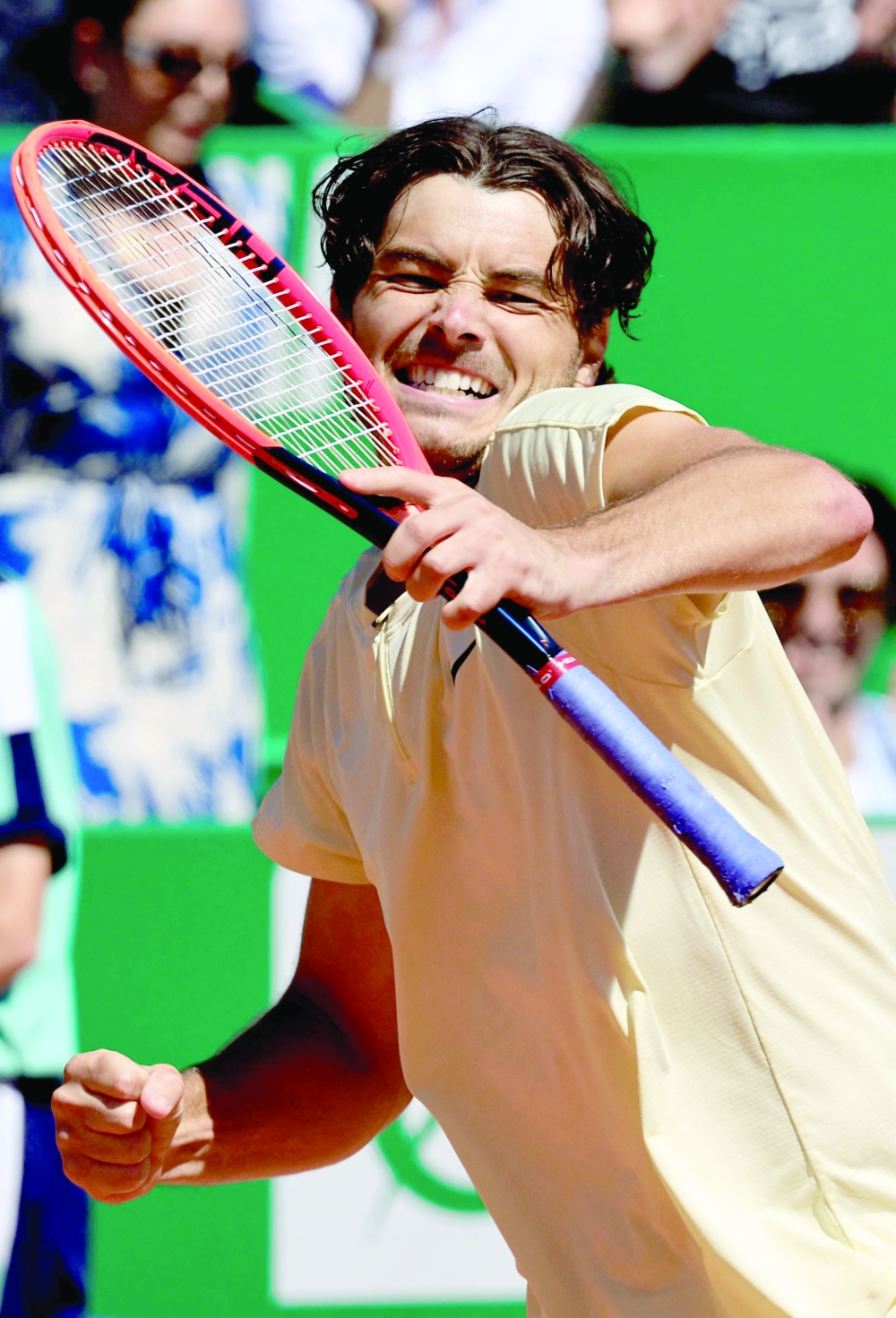 USA's Taylor Fritz celebrates after winning his match against Greece's Stefanos Tsitsipas during the Monte-Carlo ATP Masters Series tournament quarterfinal tennis match in Monte Carlo on April 14, 2023. (Photo by Valery HACHE / AFP)