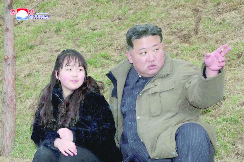 North Korean leader Kim Jong Un and his daughter Kim Ju Ae attend a test launch of a new solid-fuel ICBM Hwasong-18 at an undisclosed location. - Reuters