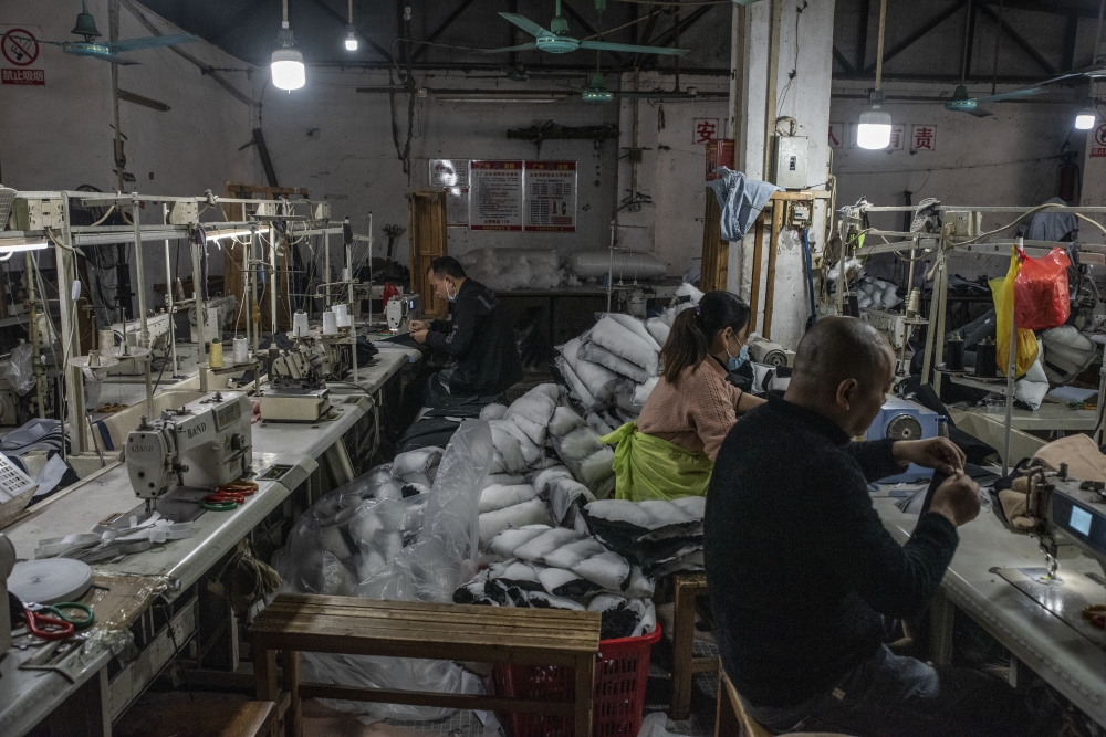 Workers at Guangzhou Basin Clothing Factory, in Guangzhou, China, on Dec. 28, 2022. (Gilles Sabrié/The New York Times)