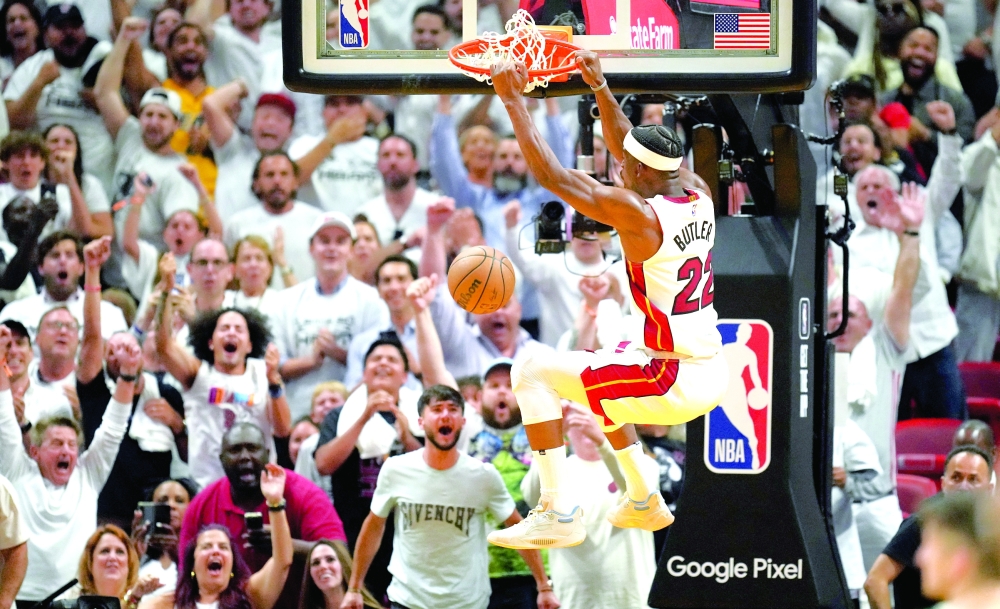 Apr 24, 2023; Miami, Florida, USA; Miami Heat forward Jimmy Butler (22) dunks against the Milwaukee Bucks in the fourth quarter during game four of the 2023 NBA Playoffs at Kaseya Center. Mandatory Credit: Jim Rassol-USA TODAY Sports
