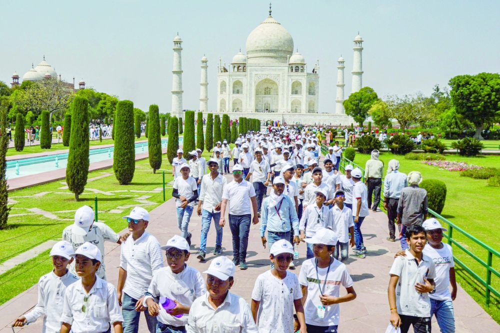 School children visit the Taj Mahal in Agra on Tuesdya. India will overtake China as the world's most populous country in the coming week. - AFP