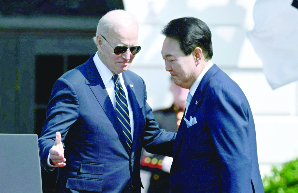 South Korea's President Yoon Suk Yeol and US President Joe Biden participate in a State Arrival ceremony on the South Lawn of the White House in Washington, DC, on Wednesday. -- AFP