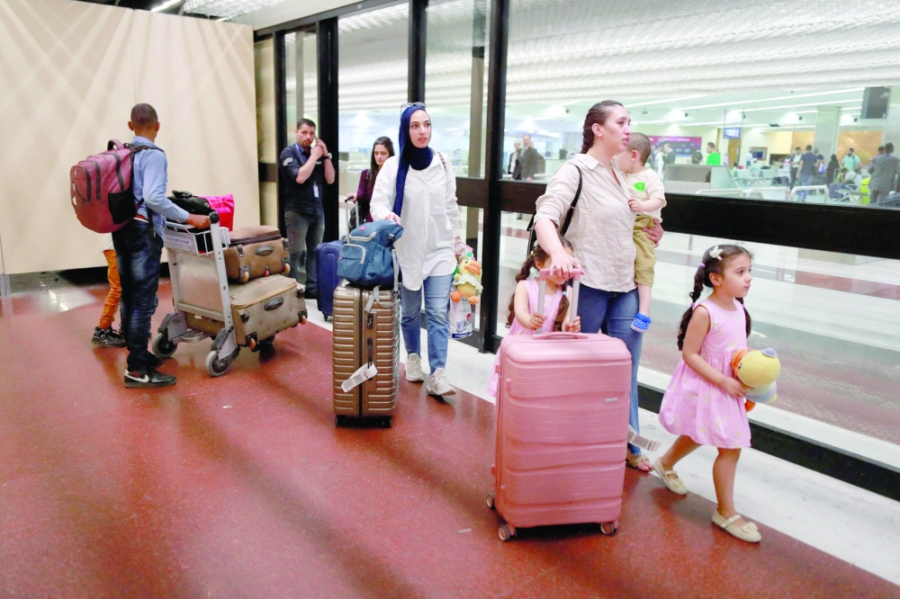People evacuated from Sudan arrive at Baghdad International Airport on April 27, 2023. Multiple nations have scrambled to evacuate thousands of citizens and embassy staff by road, air and sea from chaos-torn Sudan, where fighting between the army and paramilitaries has killed hundreds. - AFP