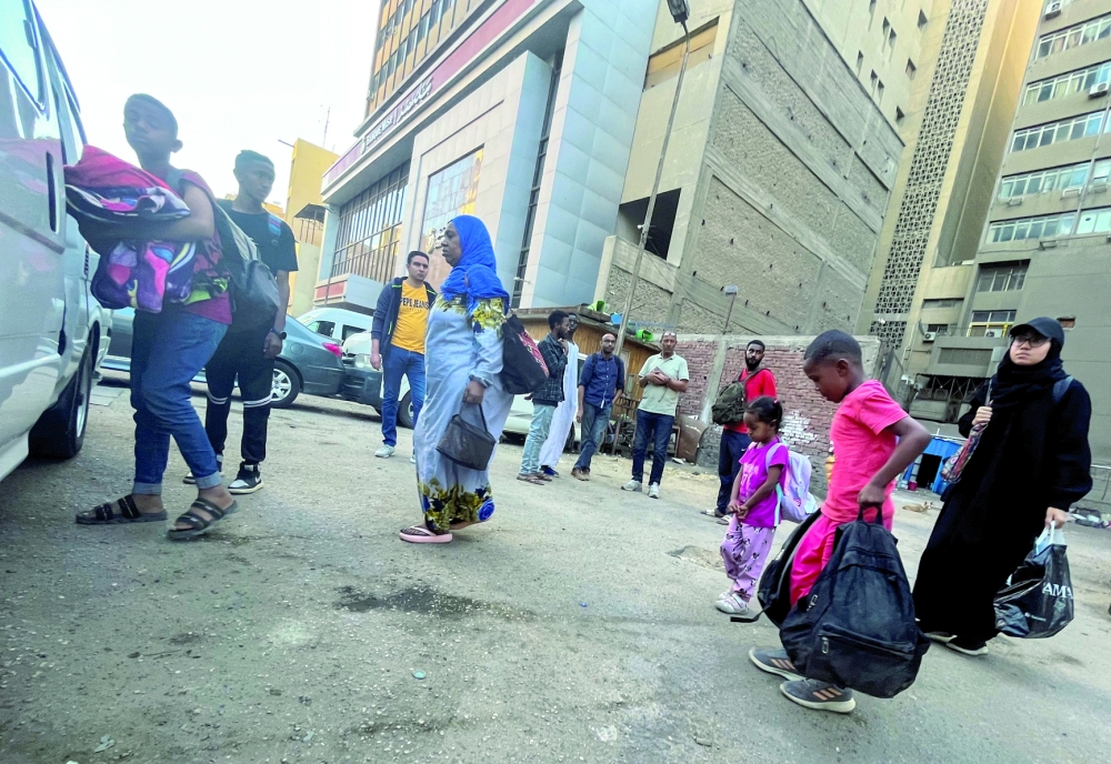 Sudanese and people from other nationalities, evacuated from the last crisis in Khartoum, arrive by bus in the Egyptian capital of Cairo, through the Argeen's southern border of Egypt-Sudan, in Cairo, Egypt - REUTERS
