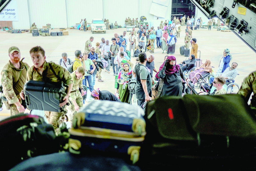 People board an RAF aircraft during the evacuation of British nationals, at Wadi Seidna Air Base in Sudan April 27, 2023. - REUTERS 