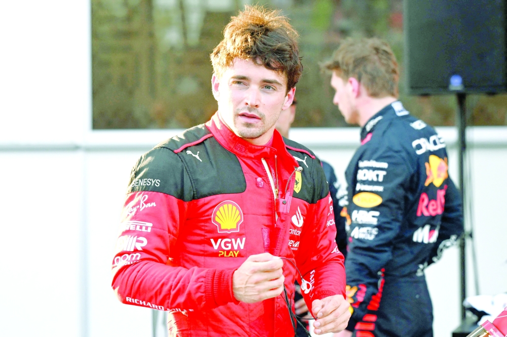 Ferrari's Monegasque driver Charles Leclerc reacts after taking the pole position after the qualifying session for the Formula One Azerbaijan Grand Prix at the Baku City Circuit in Baku on April 28, 2023. (Photo by NATALIA KOLESNIKOVA    / AFP)

